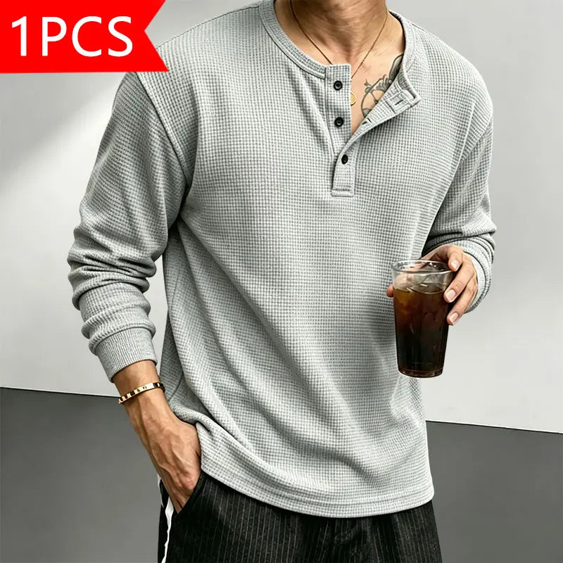 Men’s waffle-knit Henley-collar T-shirt featuring a half-button placket and small stand collar design, breathable textured knit fabric, relaxed drop-shoulder fit, solid color basic top for everyday casual wear.