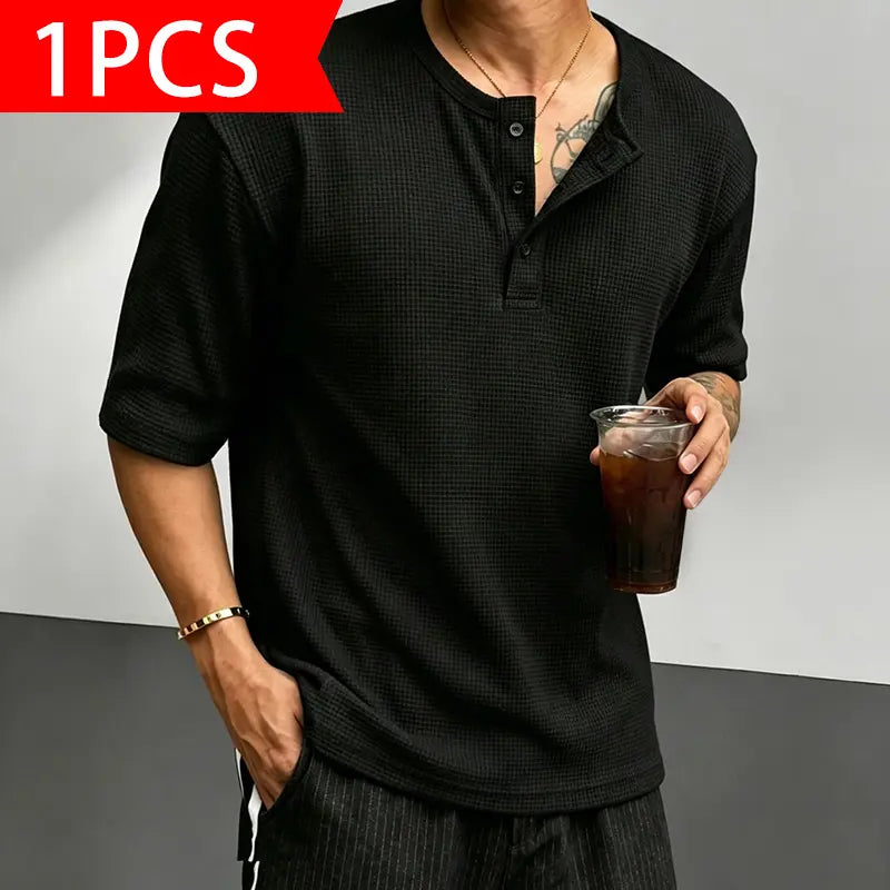 Men’s waffle-knit Henley-collar T-shirt featuring a half-button placket and small stand collar design, breathable textured knit fabric, relaxed drop-shoulder fit, solid color basic top for everyday casual wear.