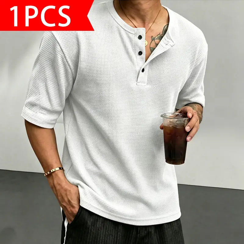 Men’s waffle-knit Henley-collar T-shirt featuring a half-button placket and small stand collar design, breathable textured knit fabric, relaxed drop-shoulder fit, solid color basic top for everyday casual wear.